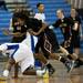 Lincoln and Dexter players dive for a loose ball on Tuesday, Jan. 29. Daniel Brenner I AnnArbor.com